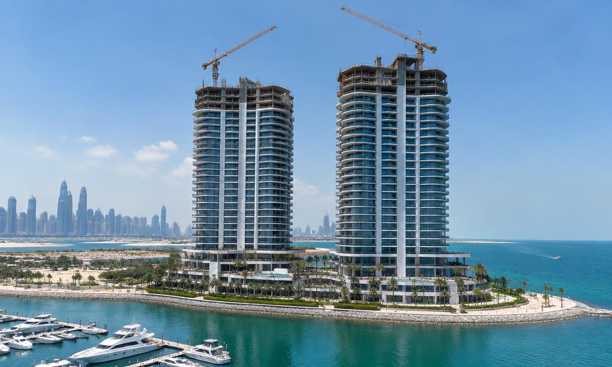 Illustrative view of two waterfront residential towers under construction in Dubai